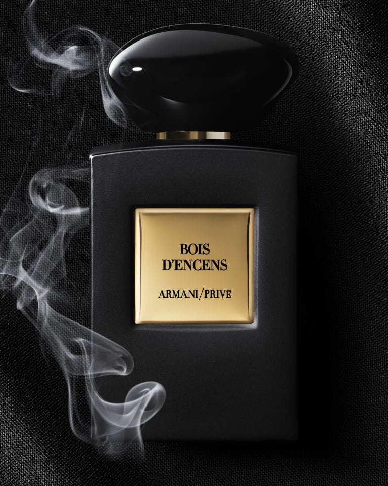 Photograph of one Armani Privè fragrance bottle against a black background