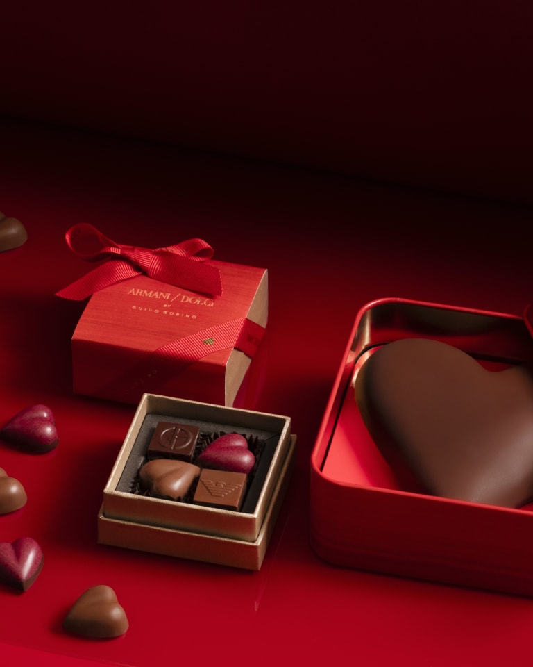 Video depicting different boxes of chocolates that seem to come to life and open up allowing chocolates to seemingly fly out into a colourful space