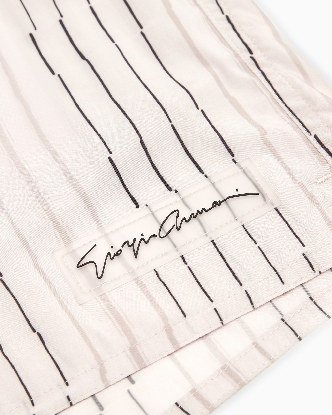 Irregular striped print swim trunks Slide 1