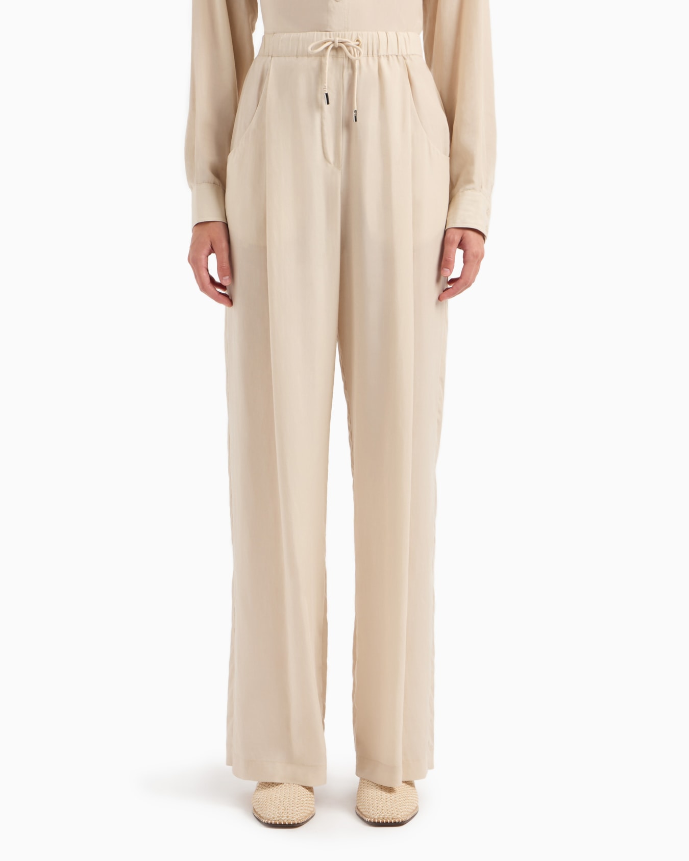 Palazzo trousers in a fluid fabric Slide 1