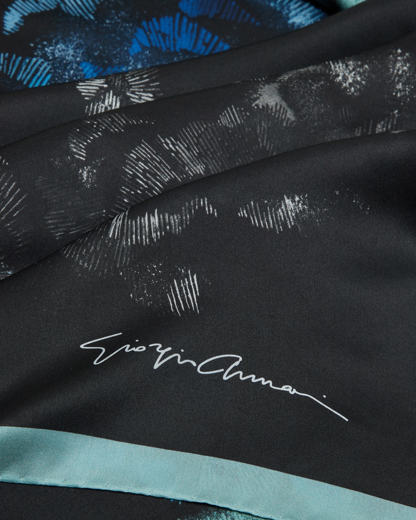 Silk foulard with a floral print Slide 1