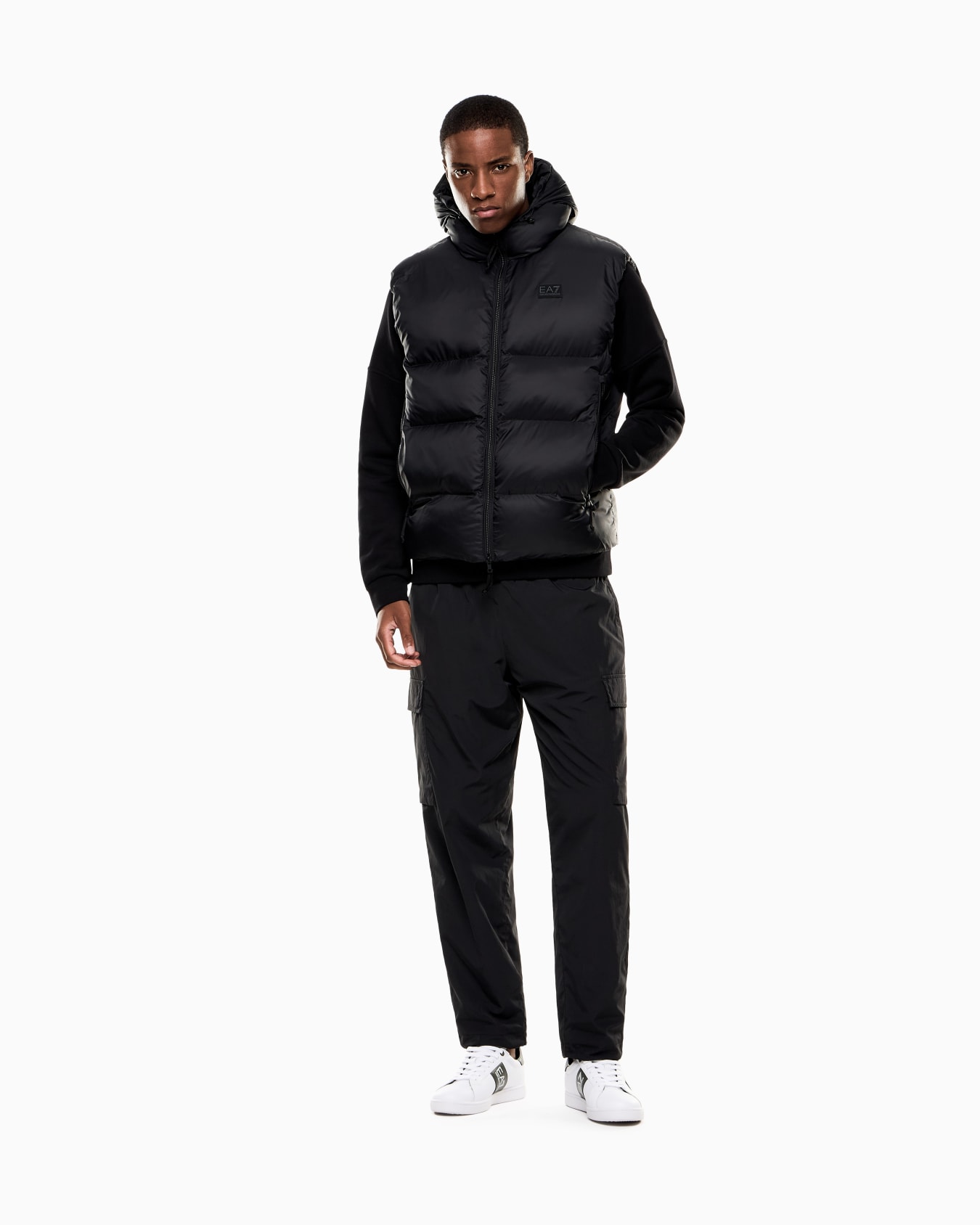 Padded, hooded gilet made of technical fabric Slide 1