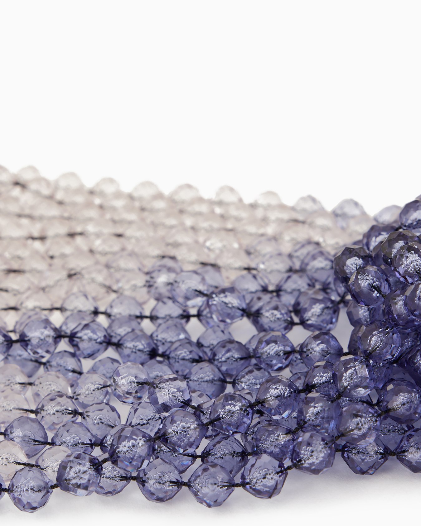 Gradient multistrand necklace with knot Slide 1