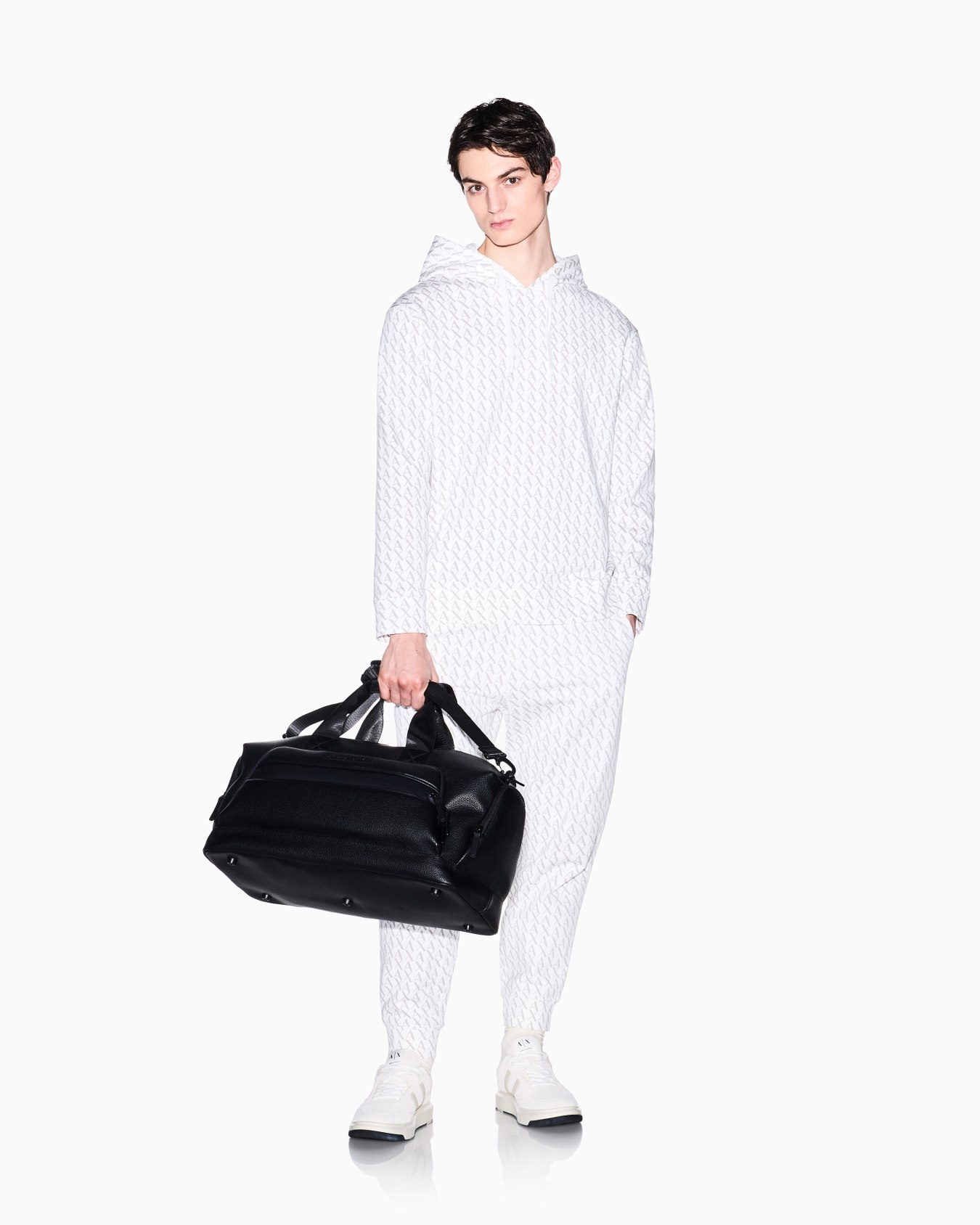 Jogger pants in fabric with allover logo pattern Slide 1