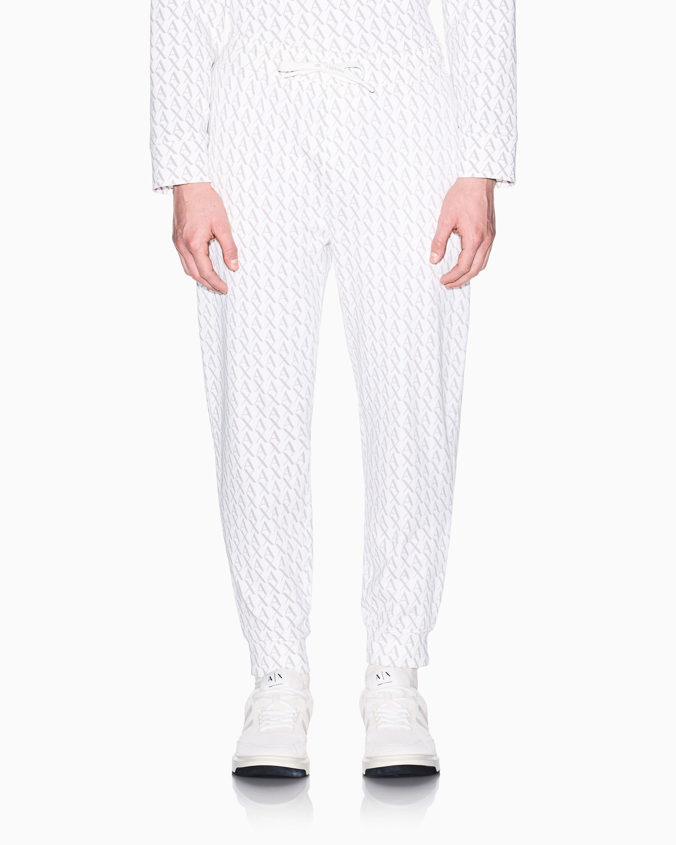 Jogger pants in fabric with allover logo pattern Slide 3