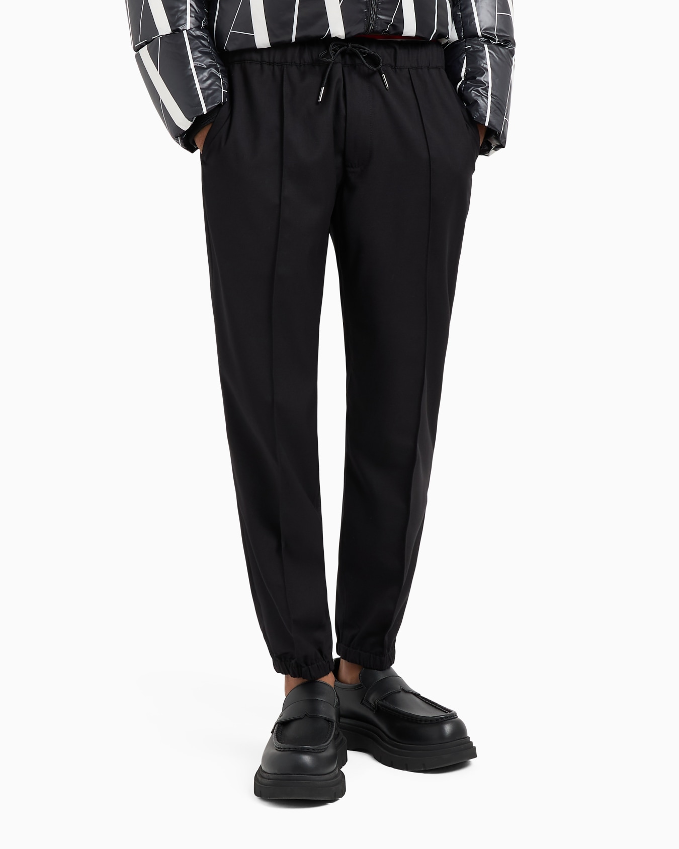Drawstring trousers with logo on the back Slide 1