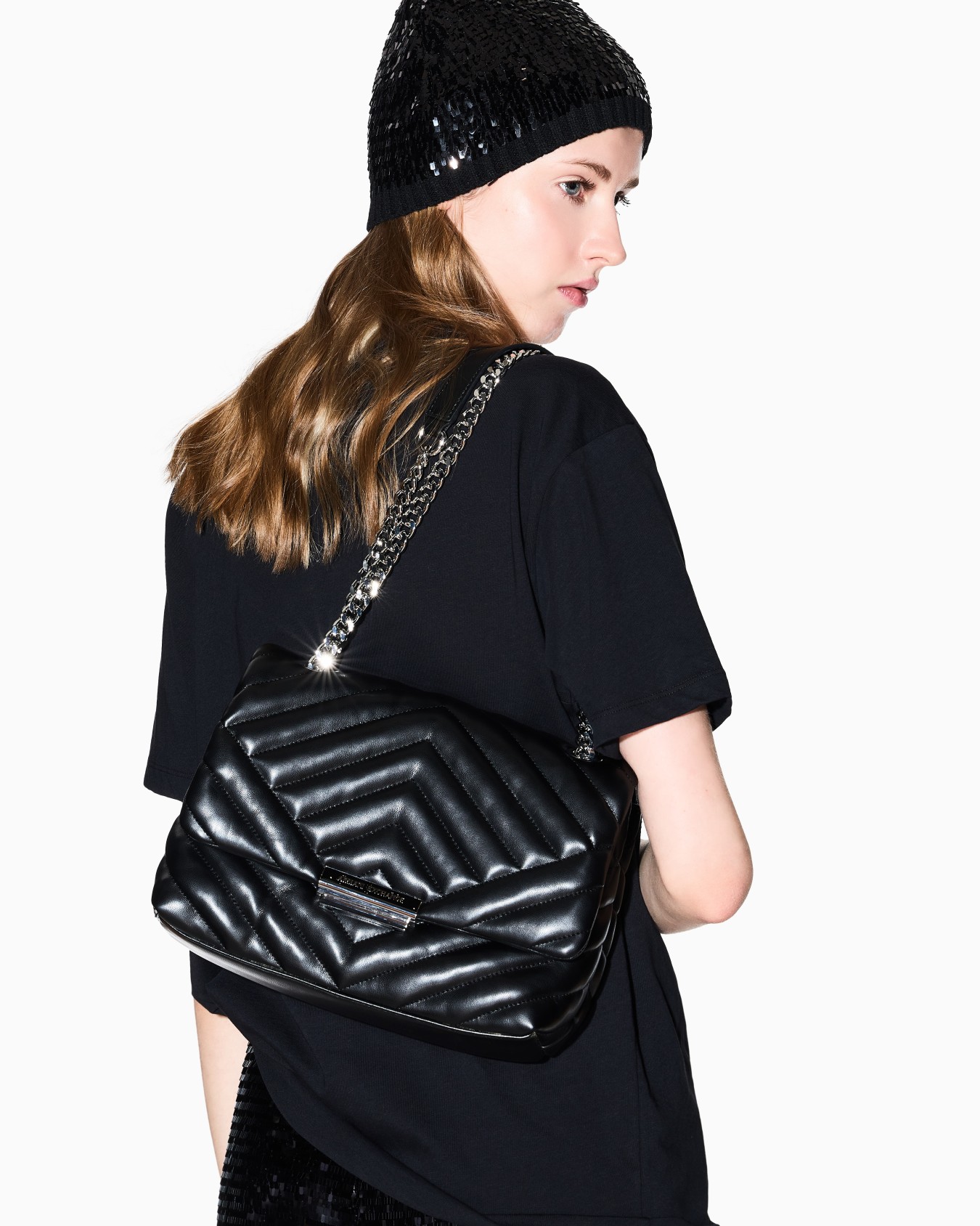 Shoulder bag in quilted material with metal details Slide 6