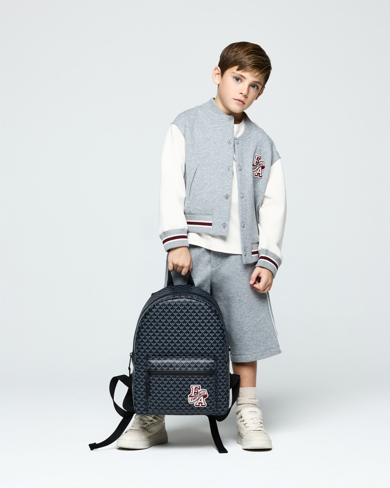 Backpack with an all-over eagle pattern and front zip pocket Slide 5