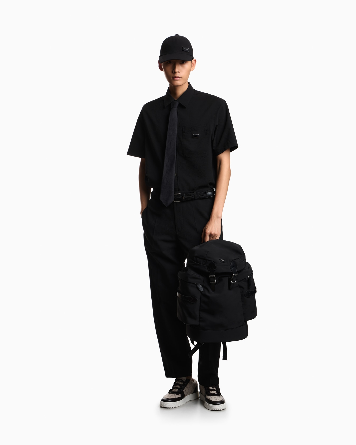 Backpack with side pockets and a top flap with metal buckles Slide 5