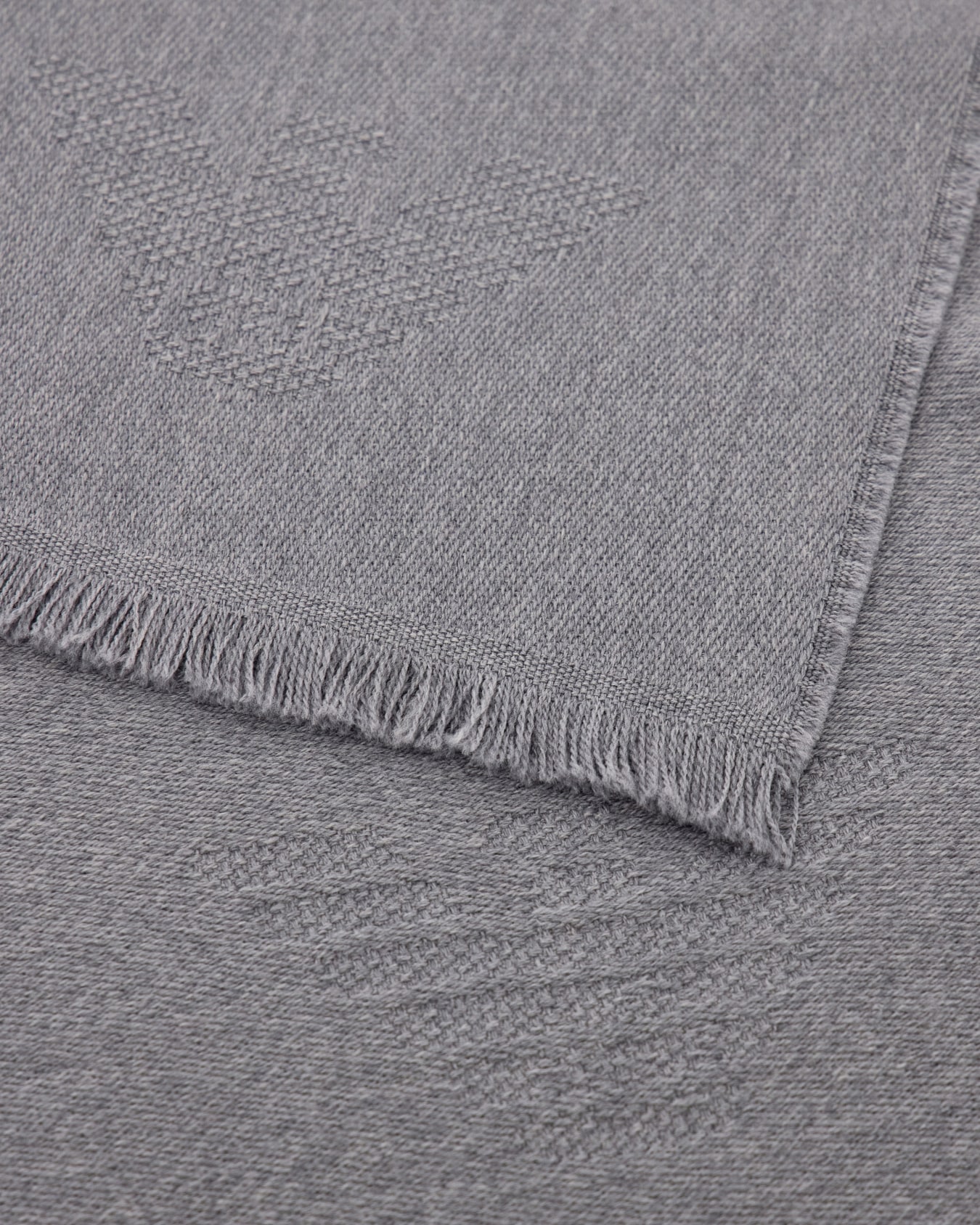 Virgin wool scarf with a woven logo and fringed edges Slide 1
