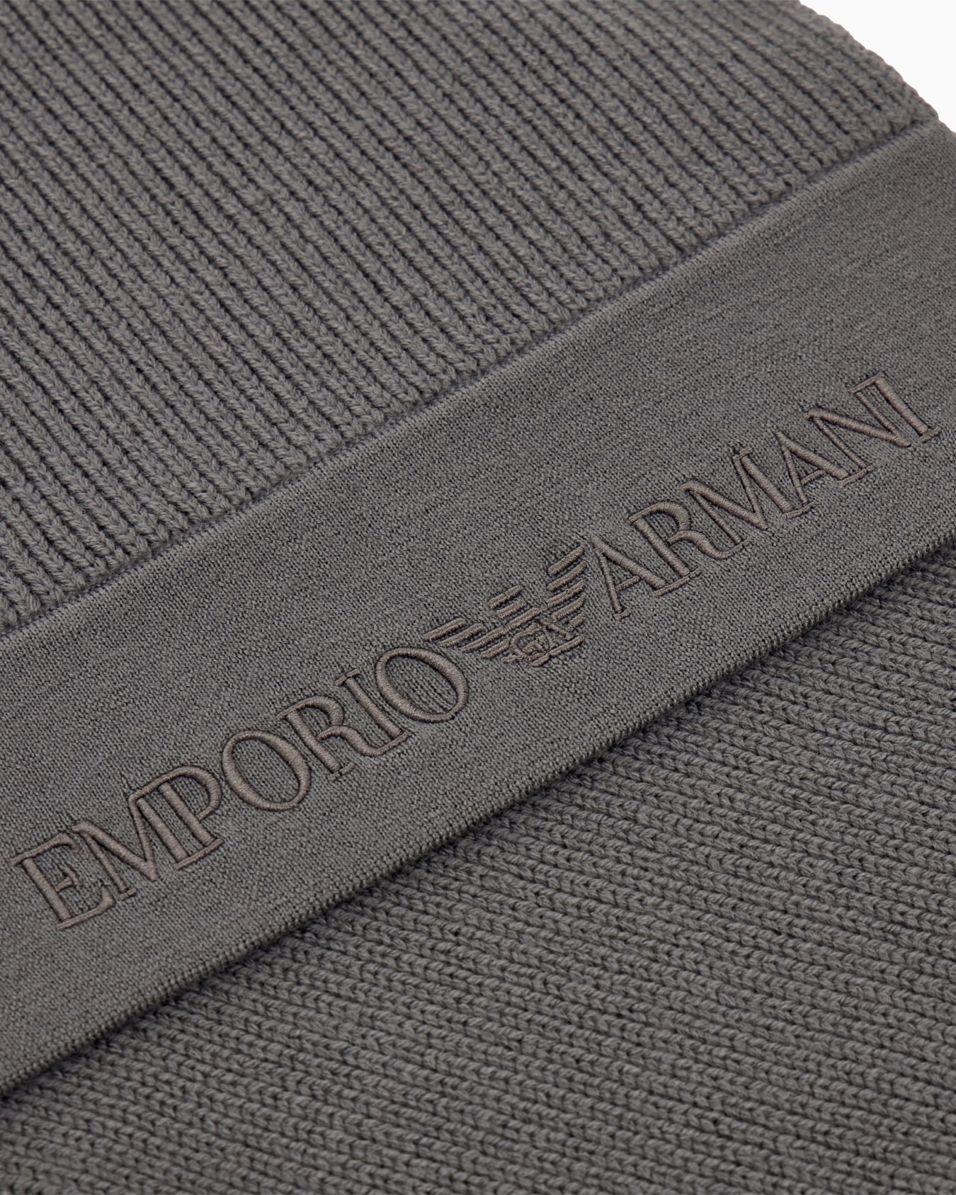 Ribbed virgin wool scarf with an embossed logo Slide 1