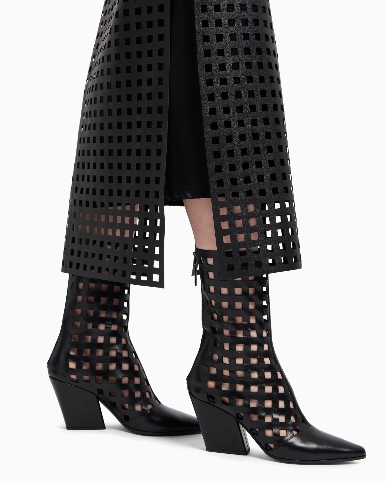 Polygon capsule collection laser-cut perforated leather ankle boots Slide 5