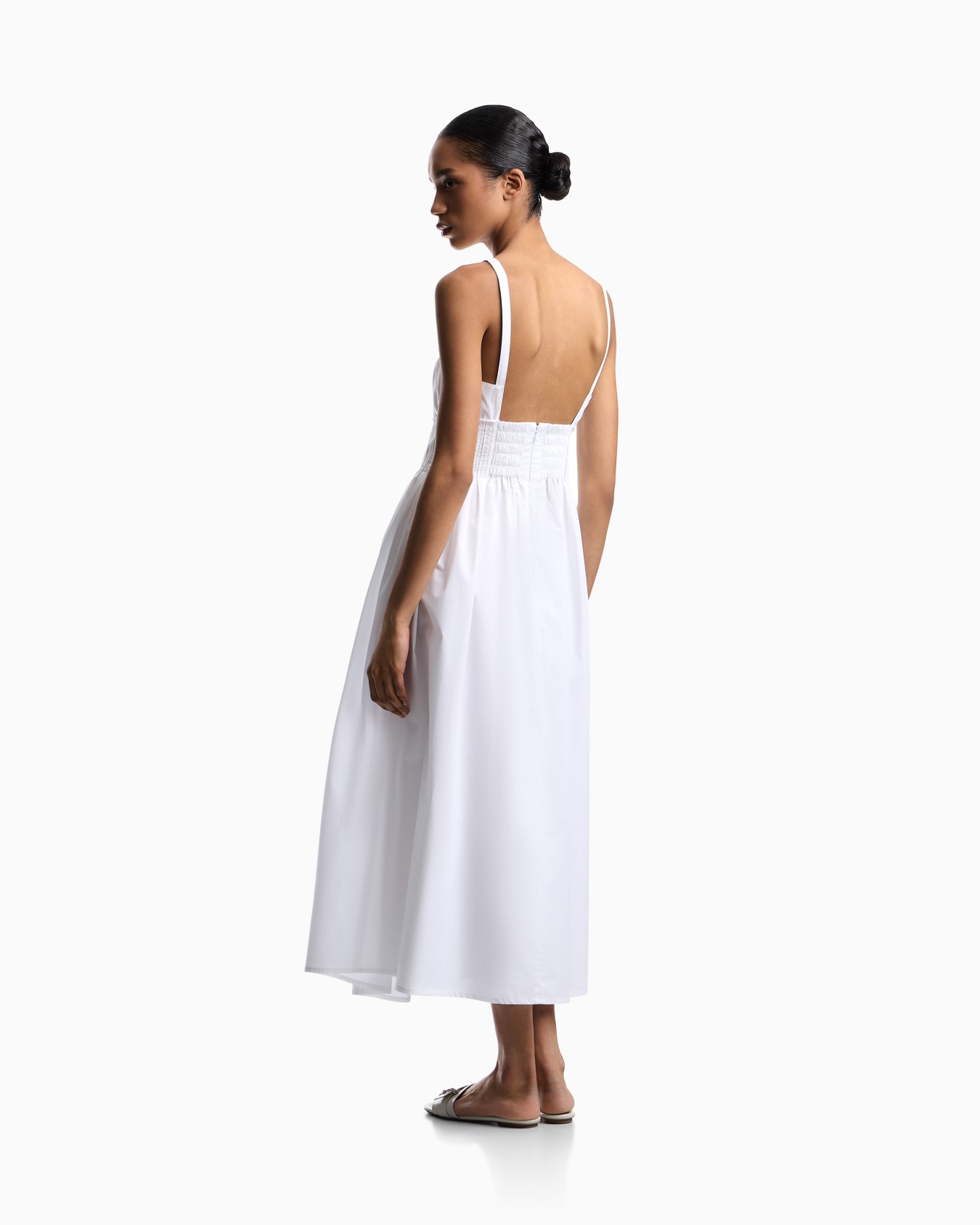 Long dress in poplin with smocked motif Slide 2