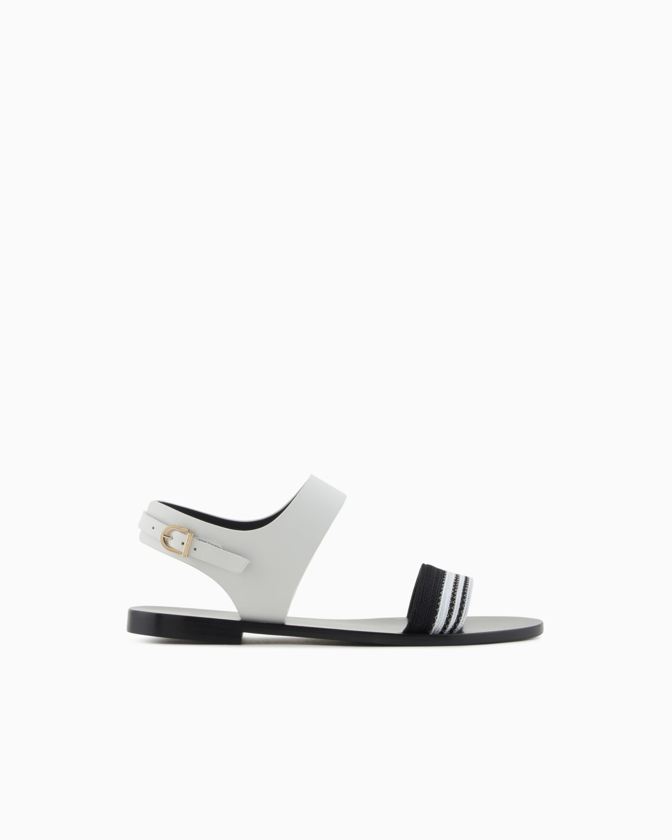 Flat sandals in leather and fabric Slide 0