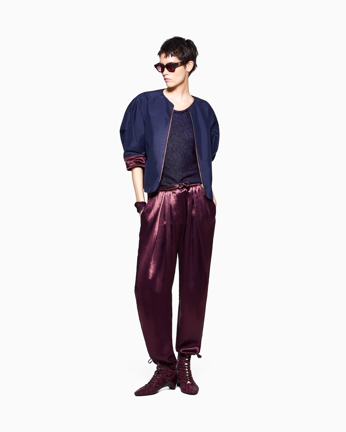 Multi-pleated trousers in silk satin with a waistband knot Slide 1