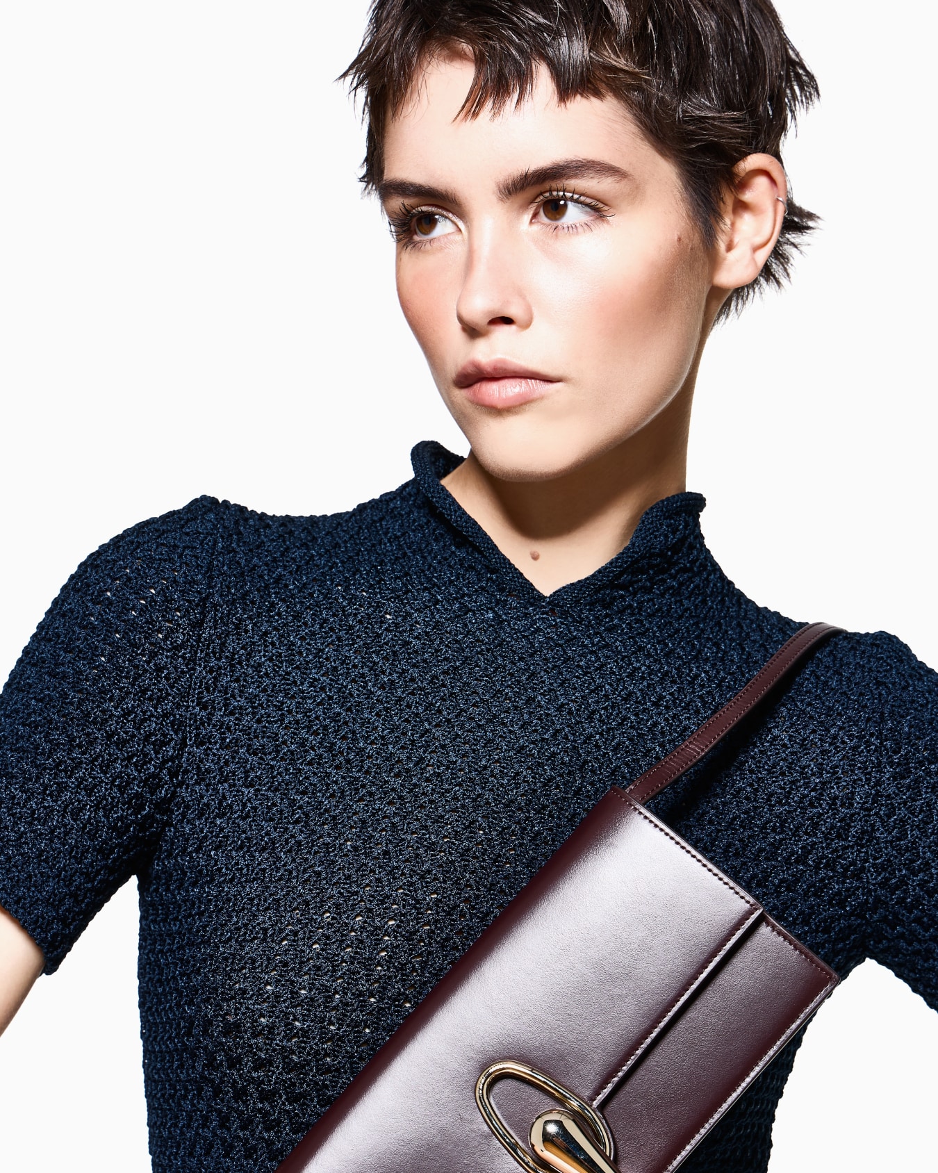 Accordion clutch in polished leather with a shoulder strap Slide 6