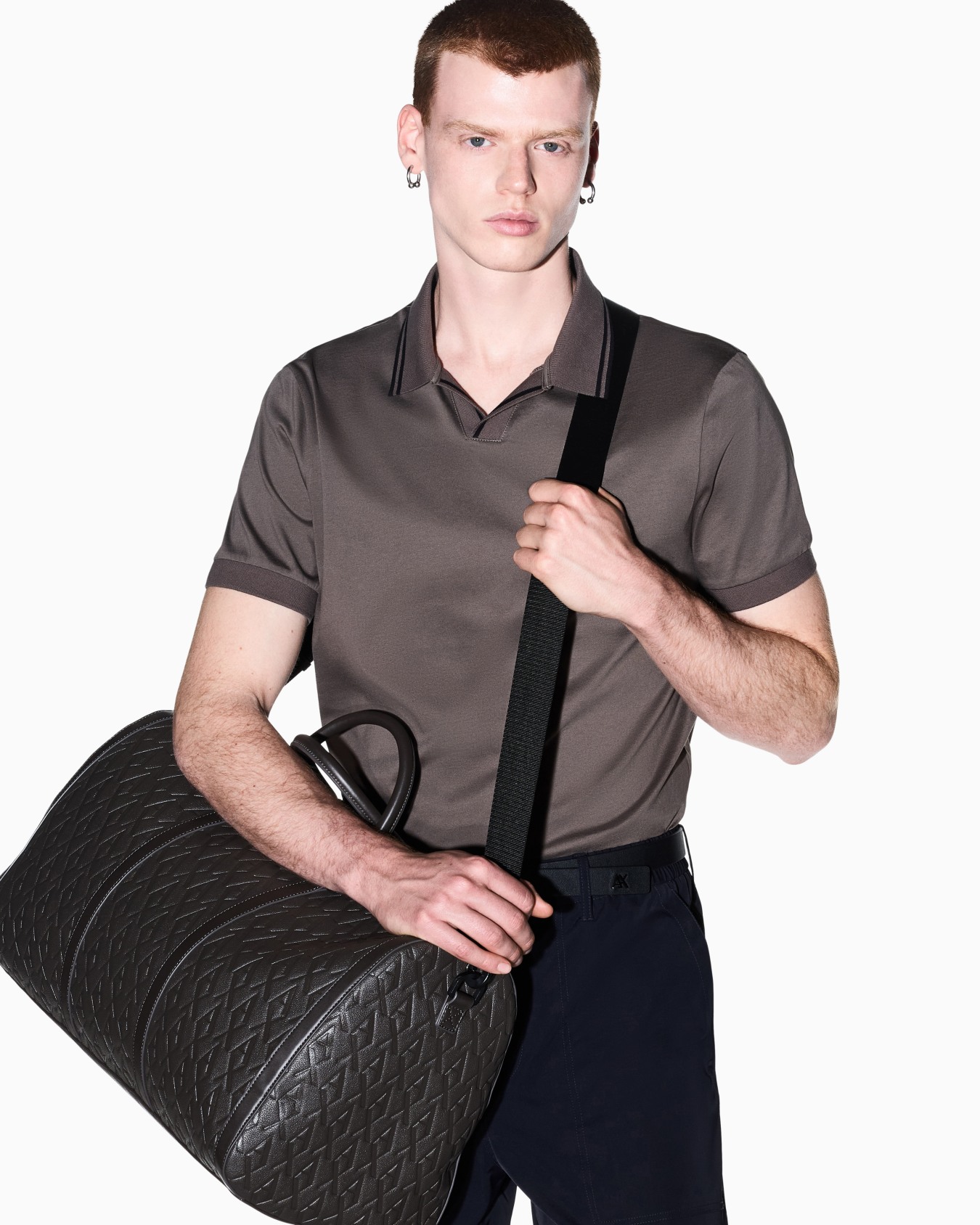 Duffel bag with an embossed pattern and a shoulder strap Slide 7