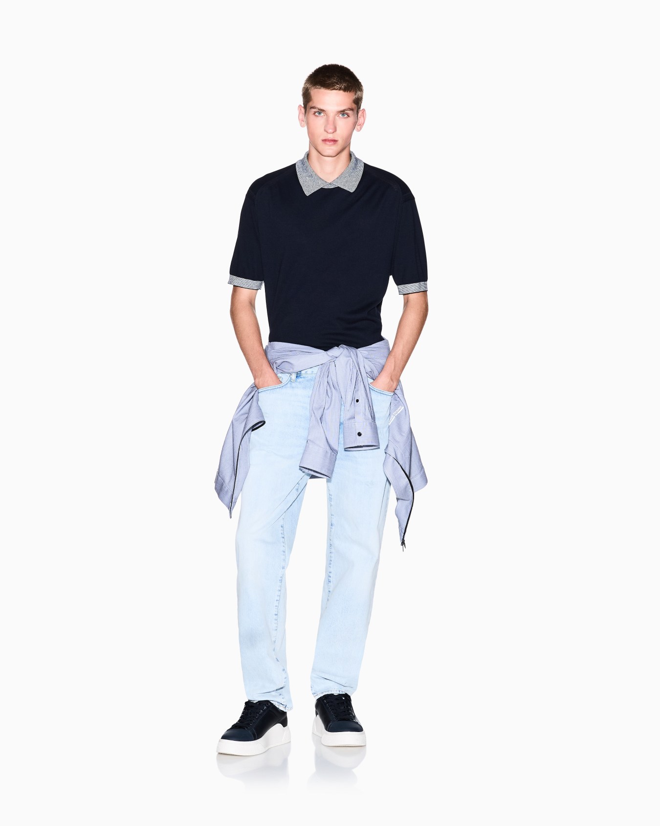 Knitted polo shirt with contrasting profiles Slide 1