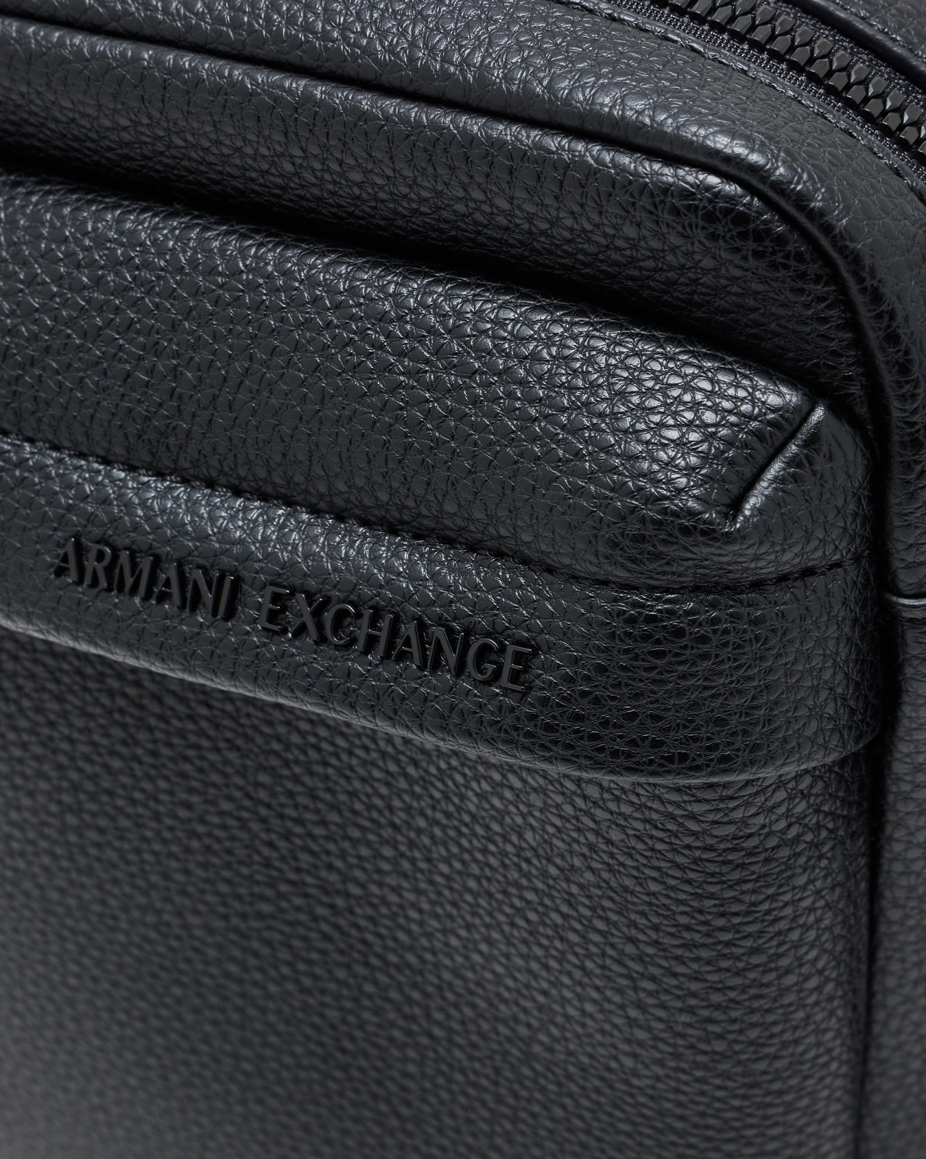 Textured crossbody bag with an embossed logo on the flap Slide 4