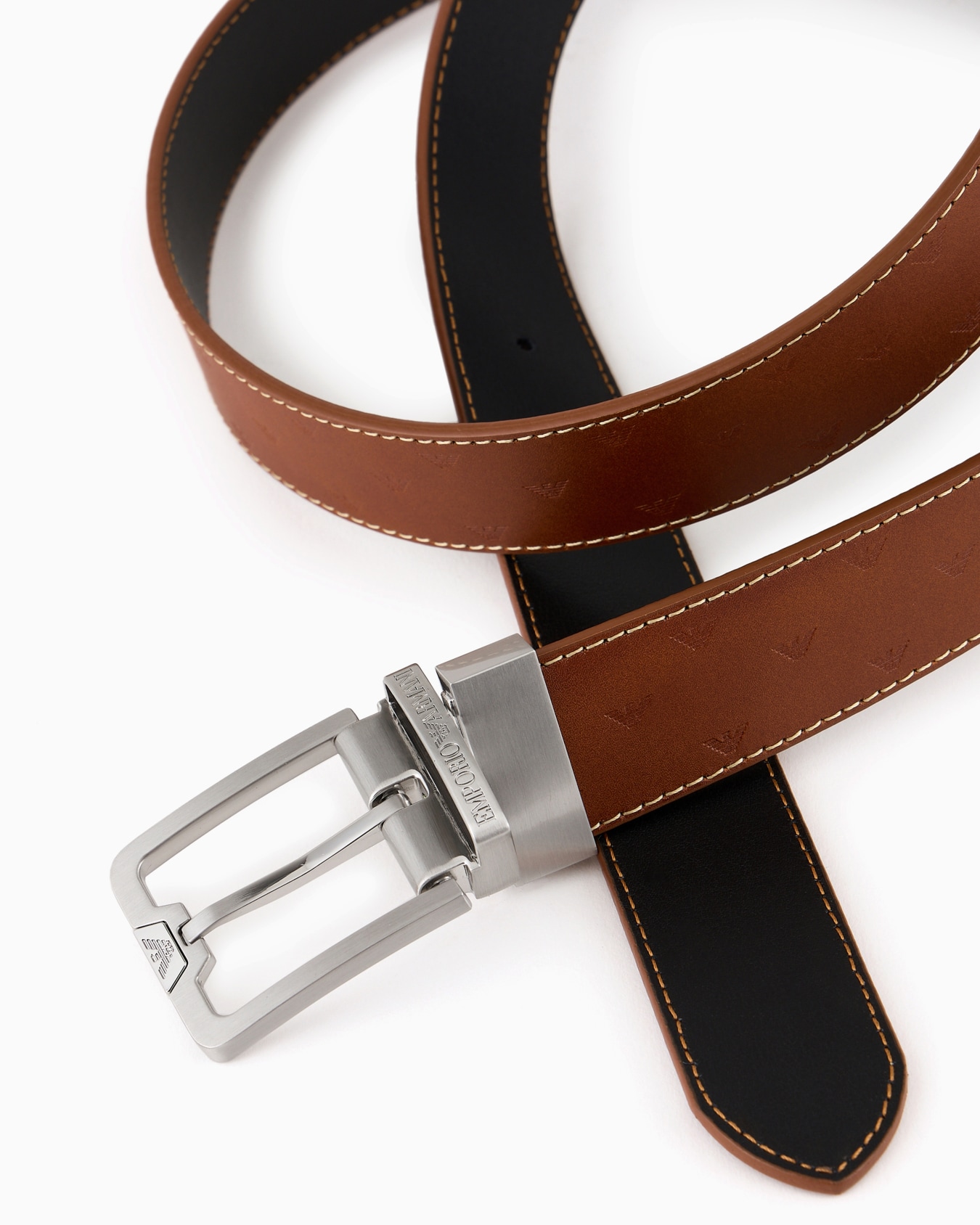 Reversible leather belt with all-over embossed eagle Slide 1