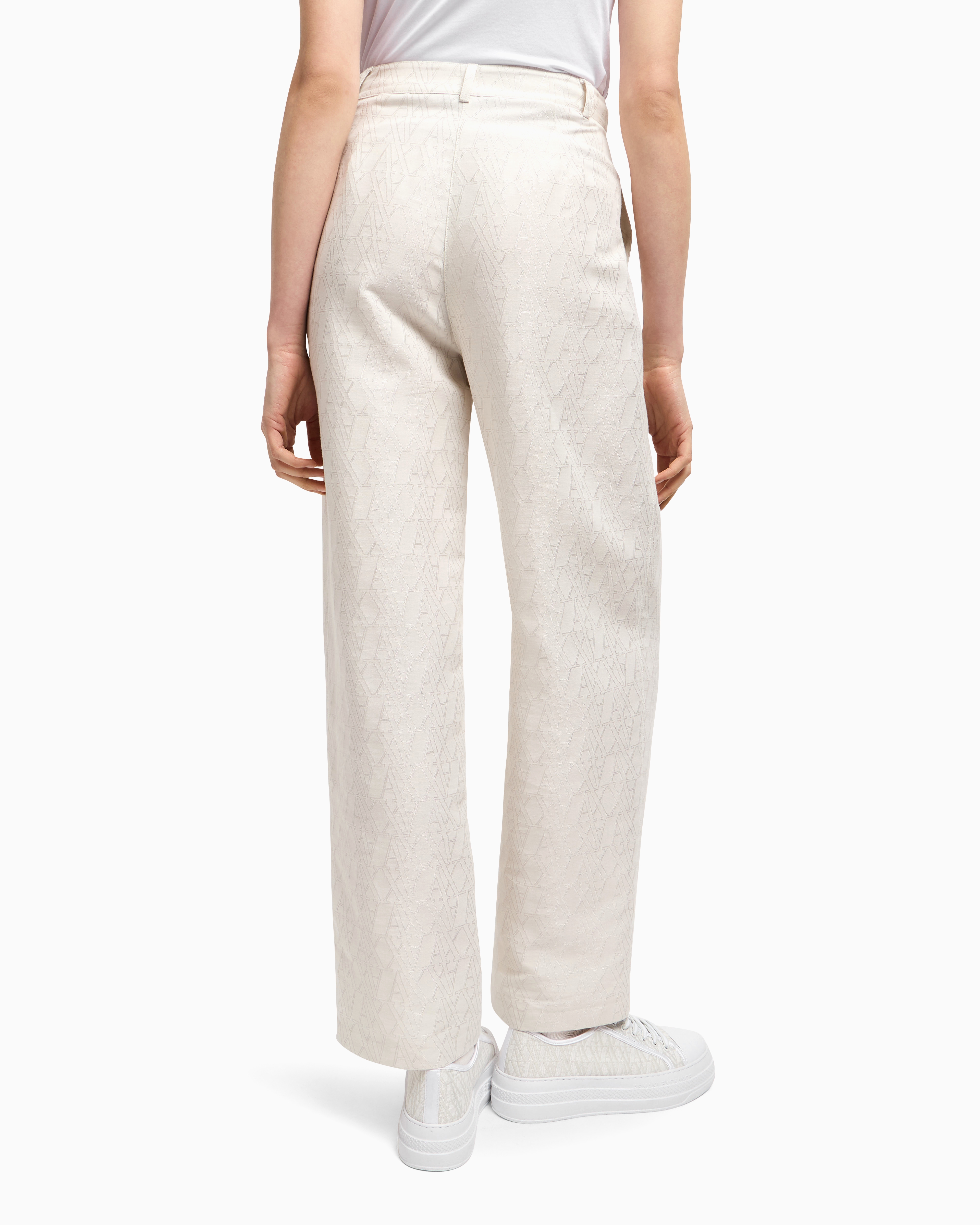 Pleated trousers with allover logo