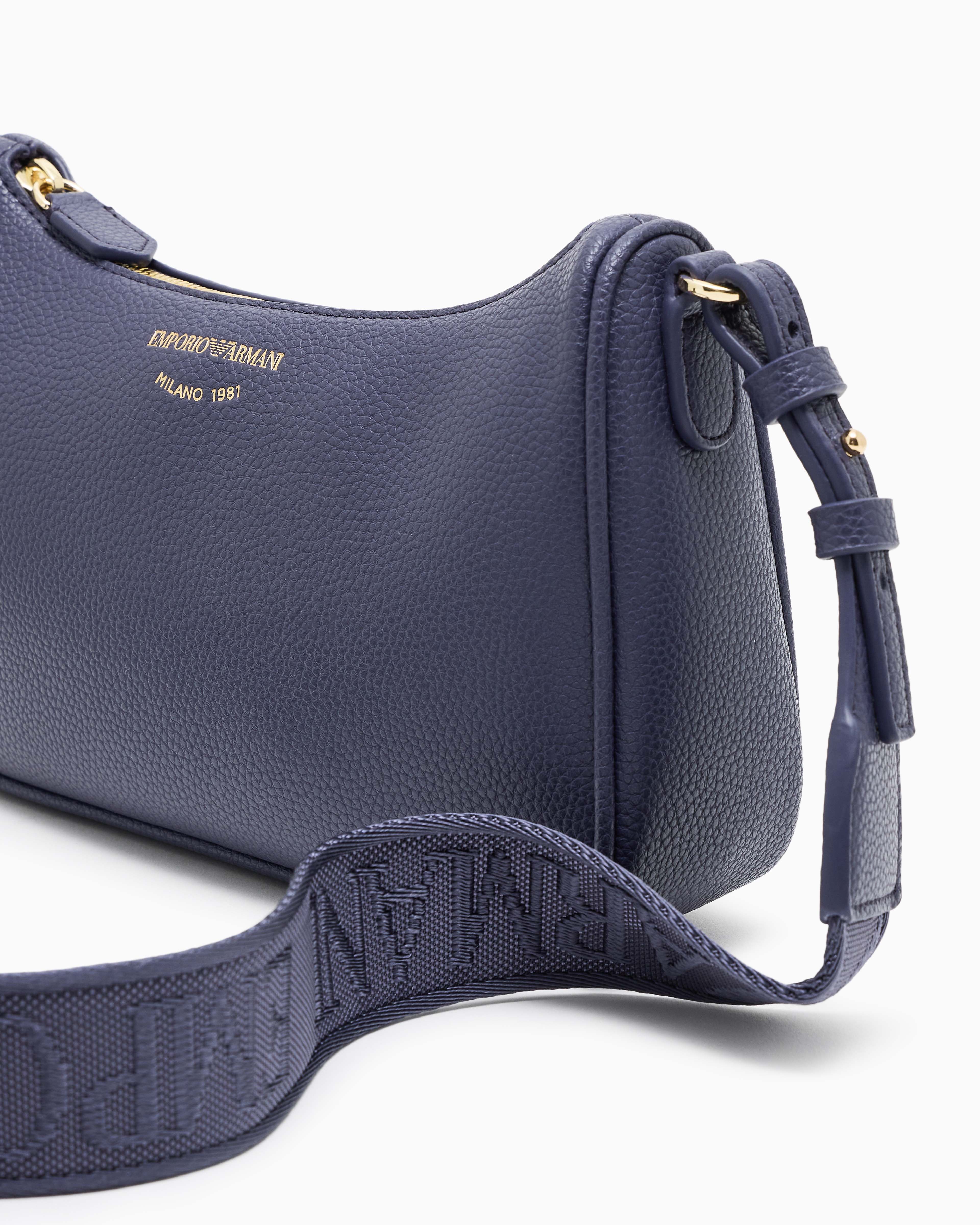 Pebbled shoulder bag with a zip closure and adjustable strap