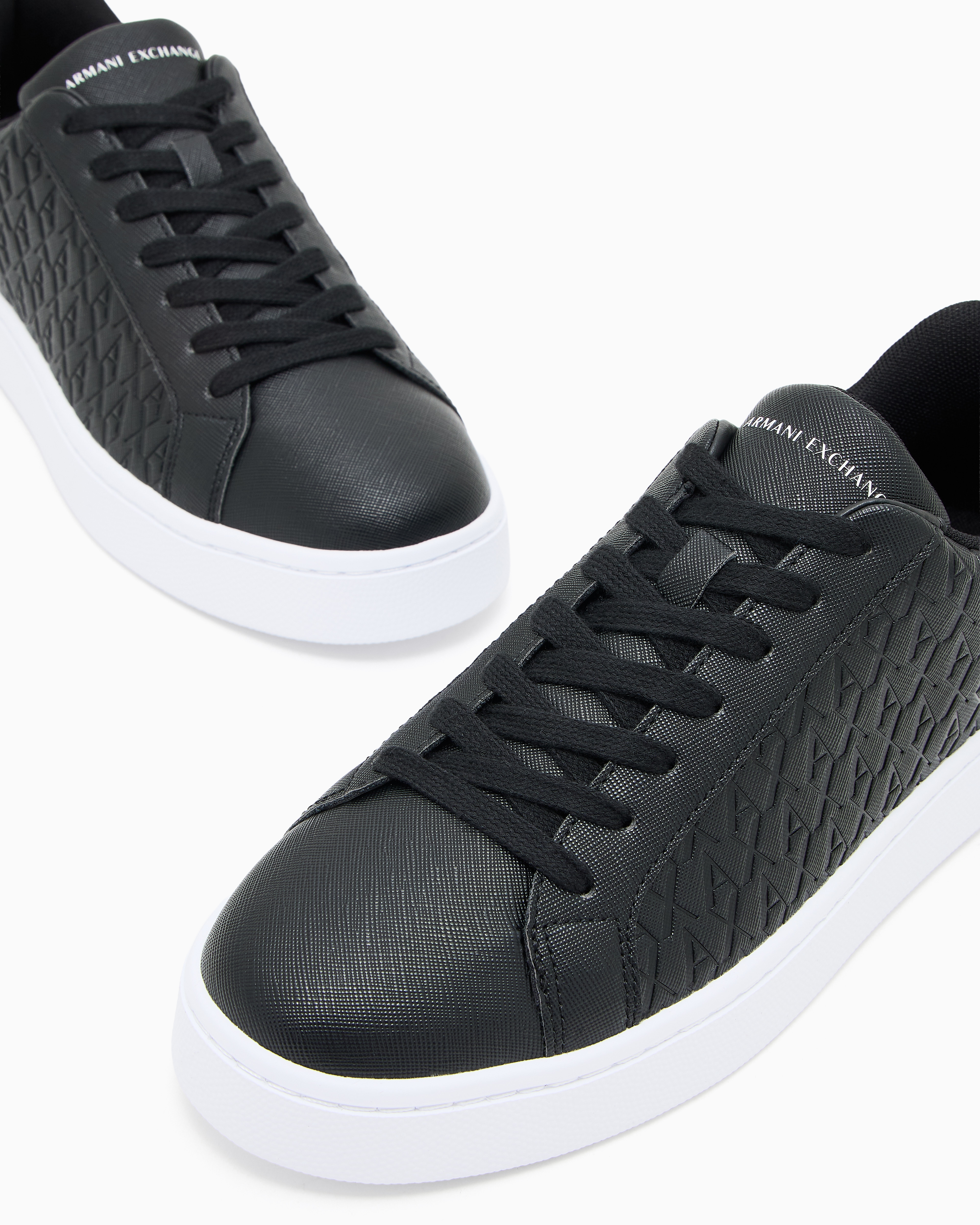 Lace-up sneakers with allover embossed logo